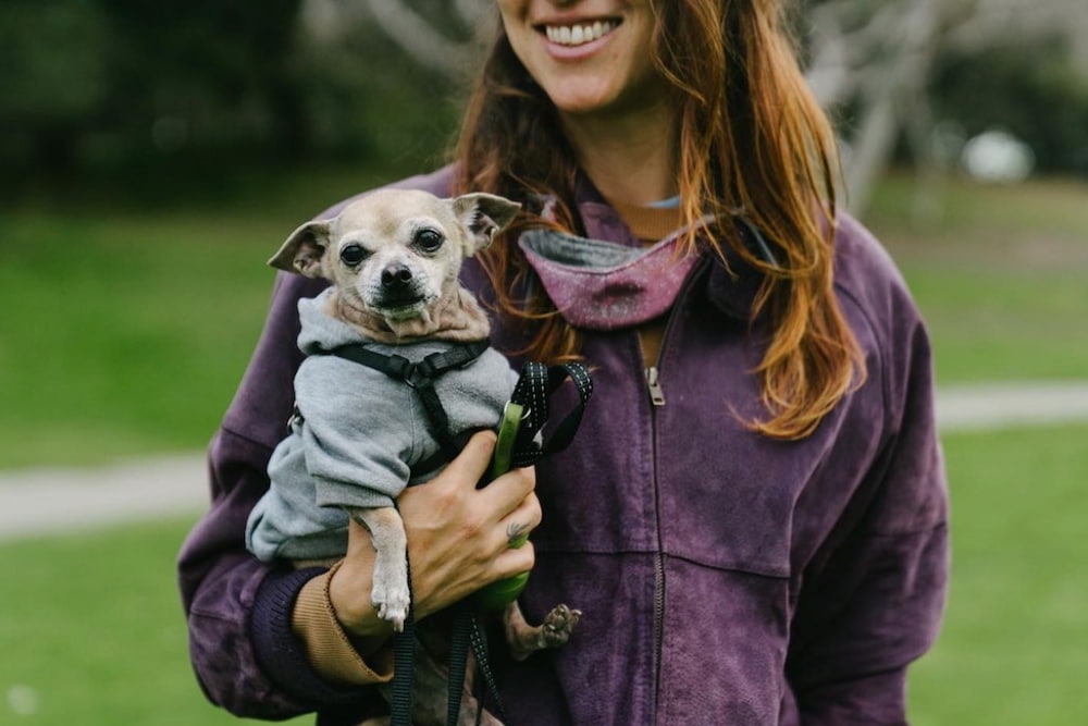 Gal holding dog